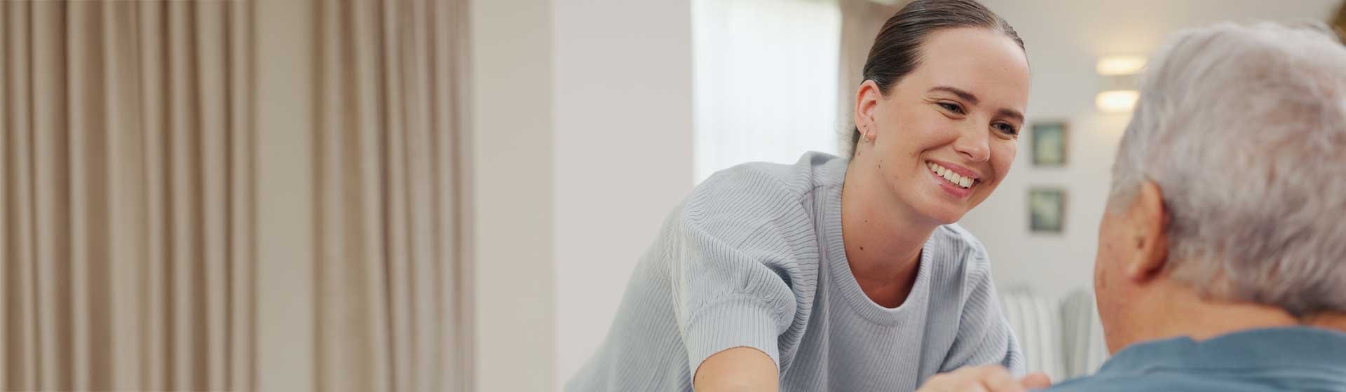 Volunteer supports a patient in a hospital
