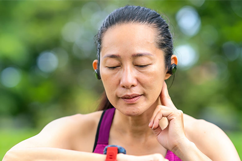 Woman checking pulse