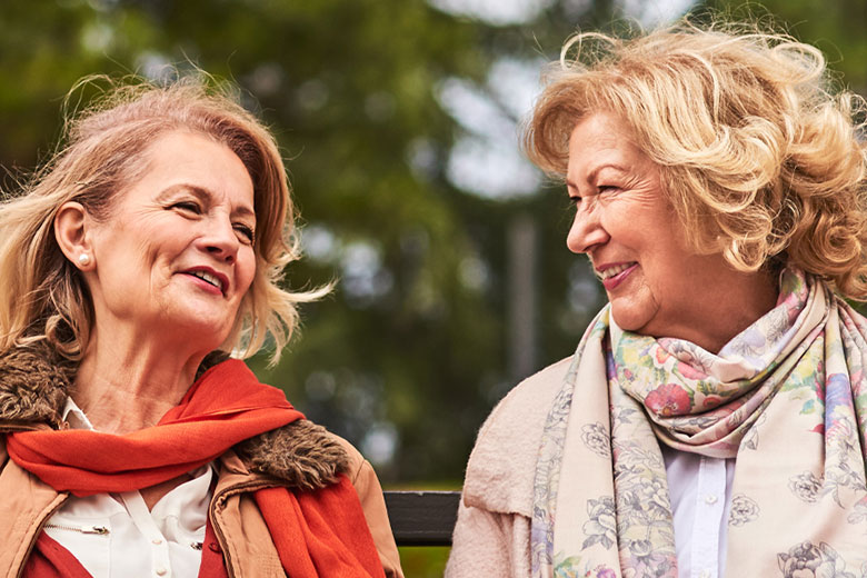 Two women talking outside