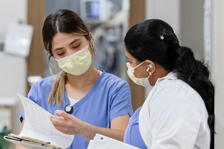 Two female doctors talking