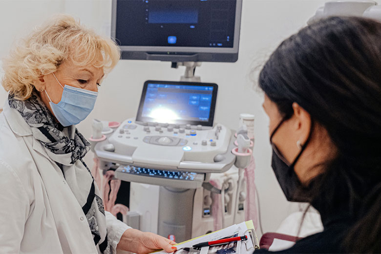 Medical staff member seeing an elderly patient